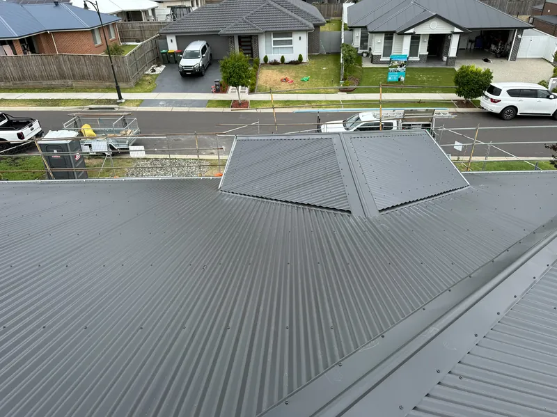 Dark grey corrugated roof on a home in a residential estate
