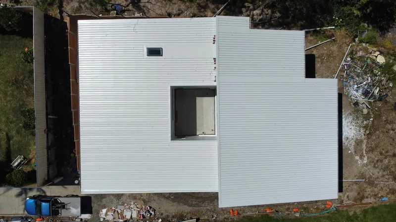 Top-down view of the Surfmist roof and skylights on the Charlestown job