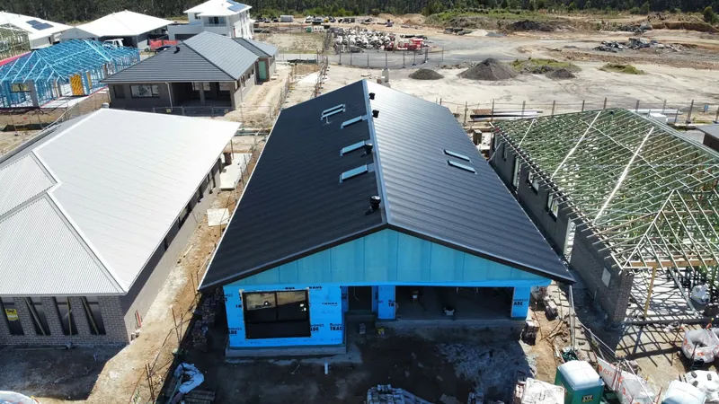Dark roof with fascia and guttering by Auzsheet Roofing in Cooranbong