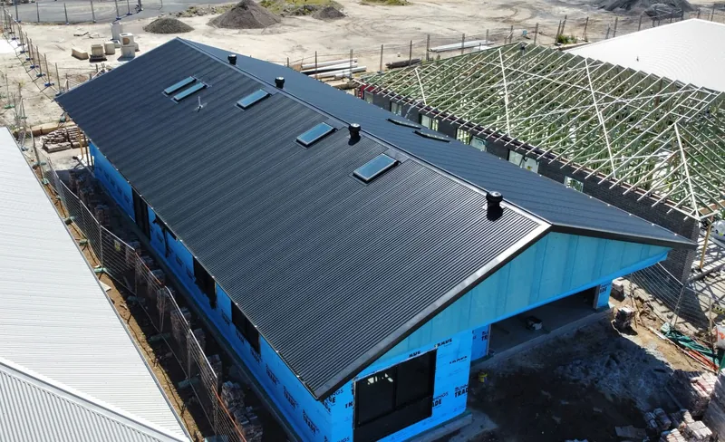 Dark roof, fascia and guttering by Auzsheet Roofing in Cooranbong