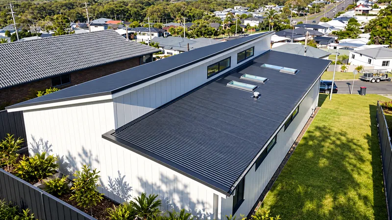 Monument roof with skylights installed by Auzsheet Roofing in Eleebana