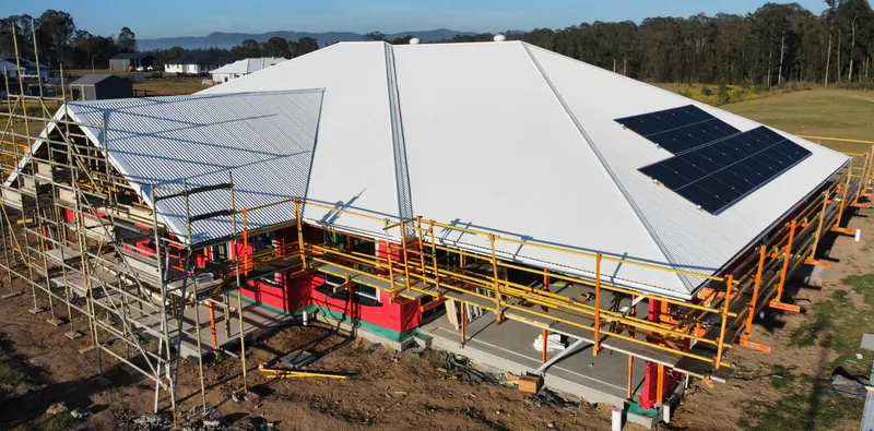 Finished Surfmist roof and front gable, with scaffolding still up, in Tingira Heights