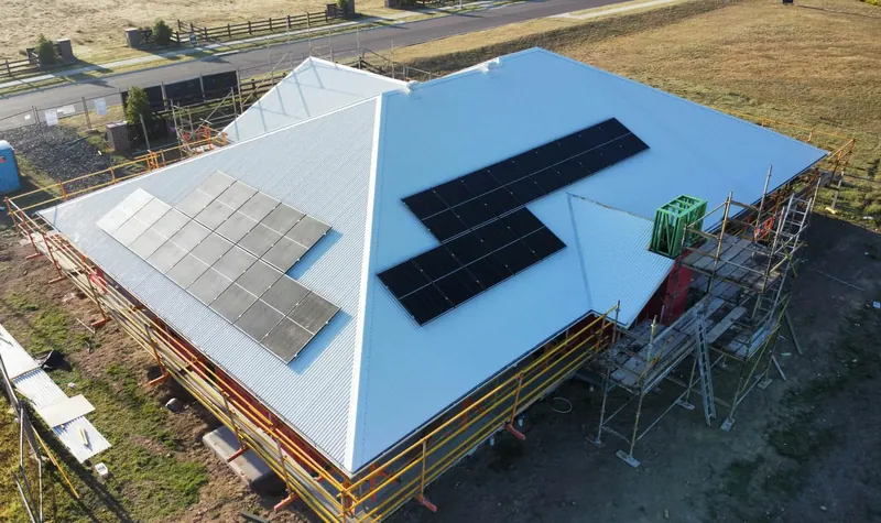 Finished Surfmist roof with two solar panel arrays in Tingira Heights