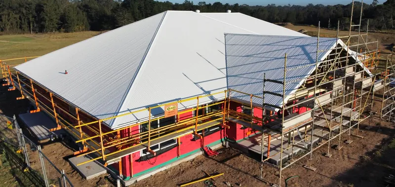 Finished Surfmist roof seen from the side, with scaffolding, in Tingira Heights