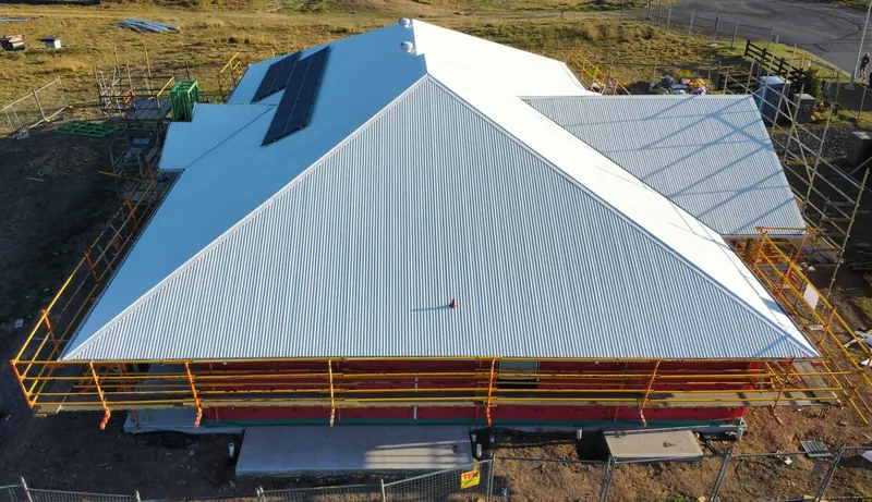 Surfmist roof and solar panel, with scaffolding still in place, in Tingira Heights