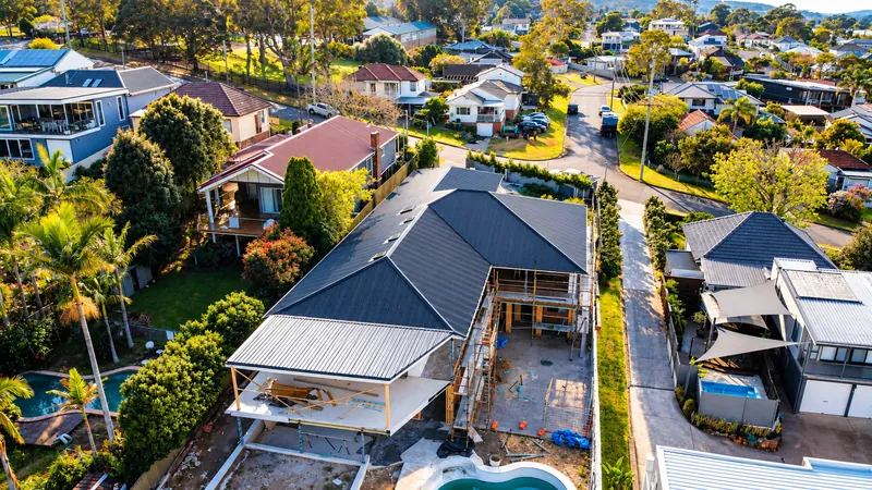 Dark roof with fascia and guttering by Auzsheet Roofing on a Warners Bay home